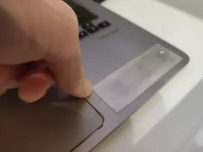 How To Remove Stickers On Laptop? : Removing stickers on laptop using nails